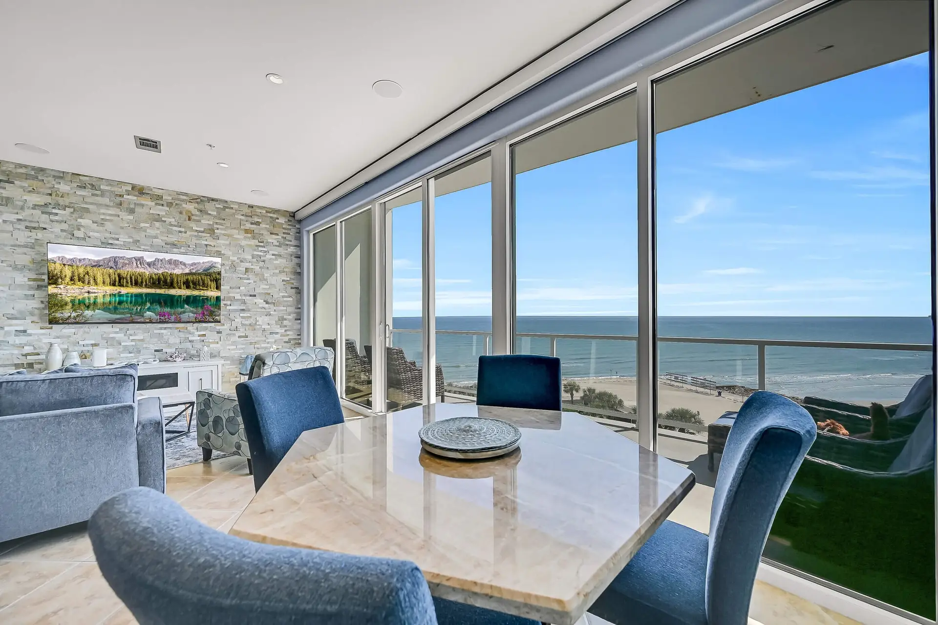 an image of a beach view sitting area to meals at a table