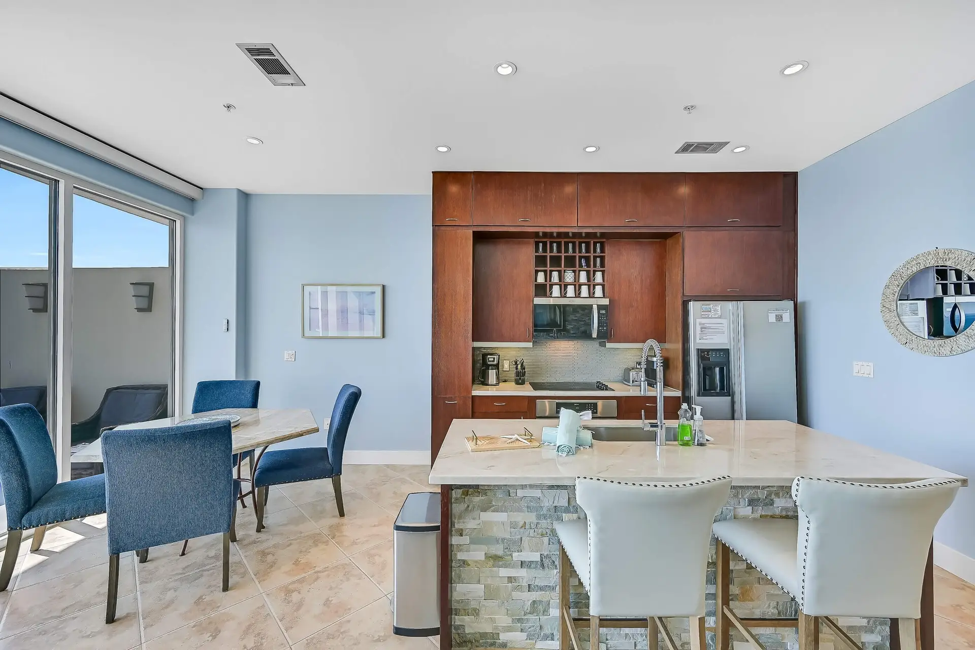Image of an open concept kitchen and eating area with a modern look